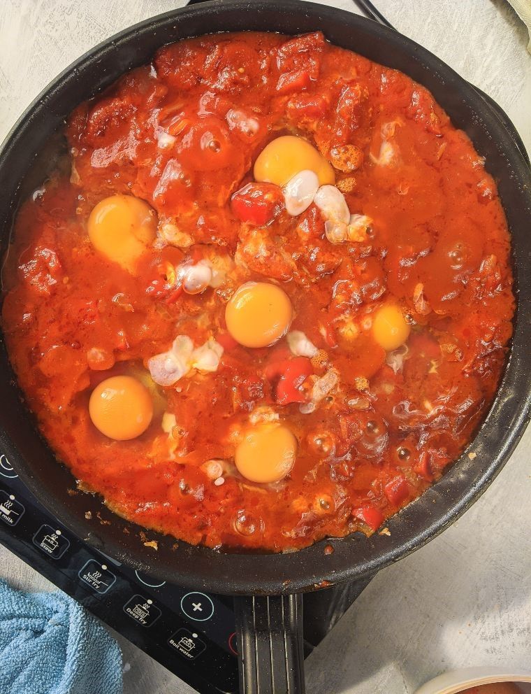 cracked eggs in pan
