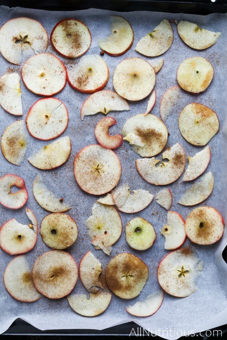 apples on sheet with cinnamon