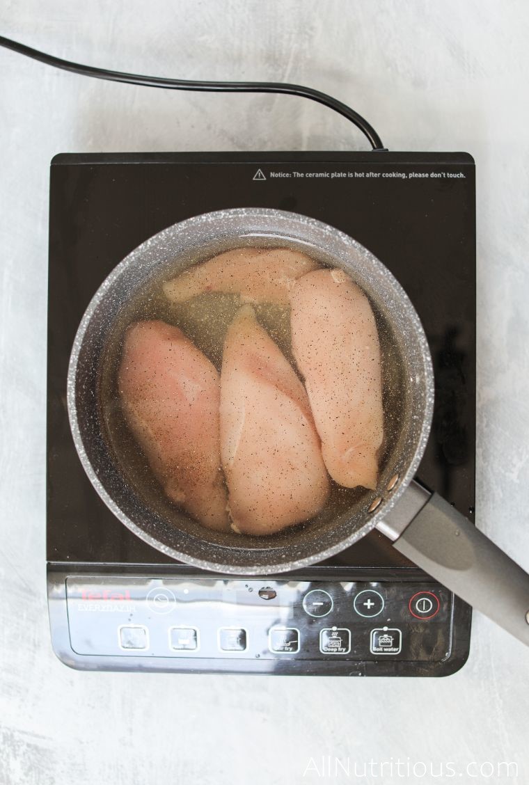 chicken breasts in pot on stove
