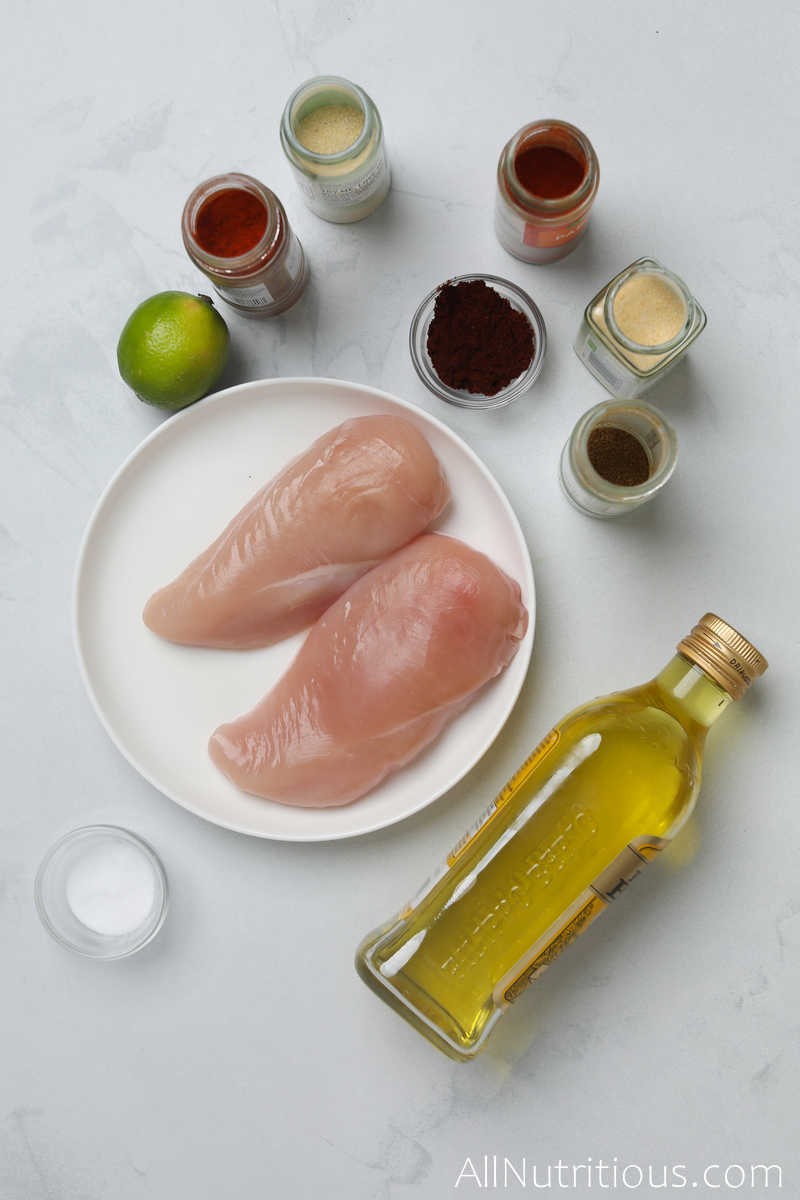 chicken breasts, spice jars, and oil