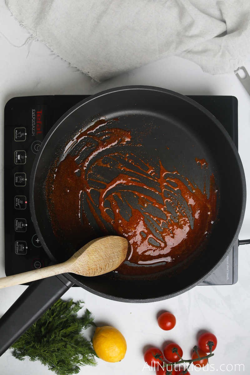 stirring sauce in pan 
