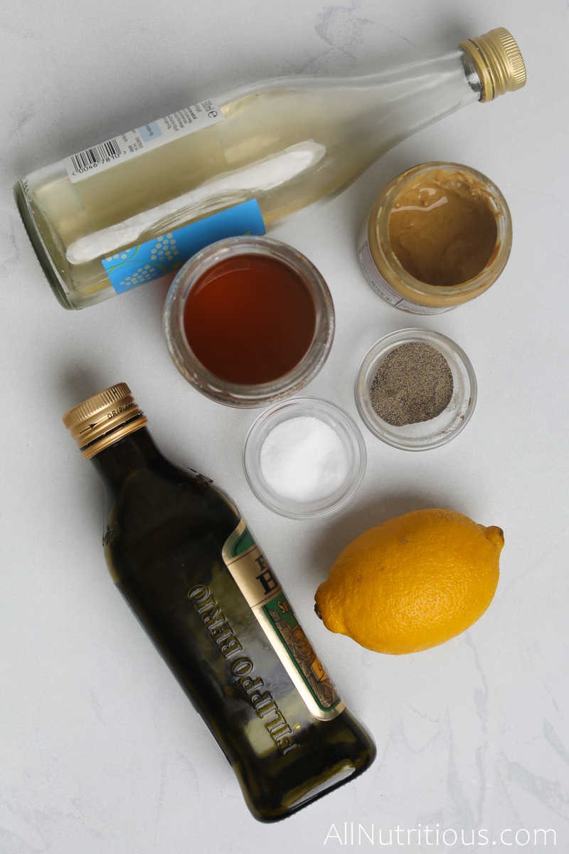 a lemon, bowls of spices and oil