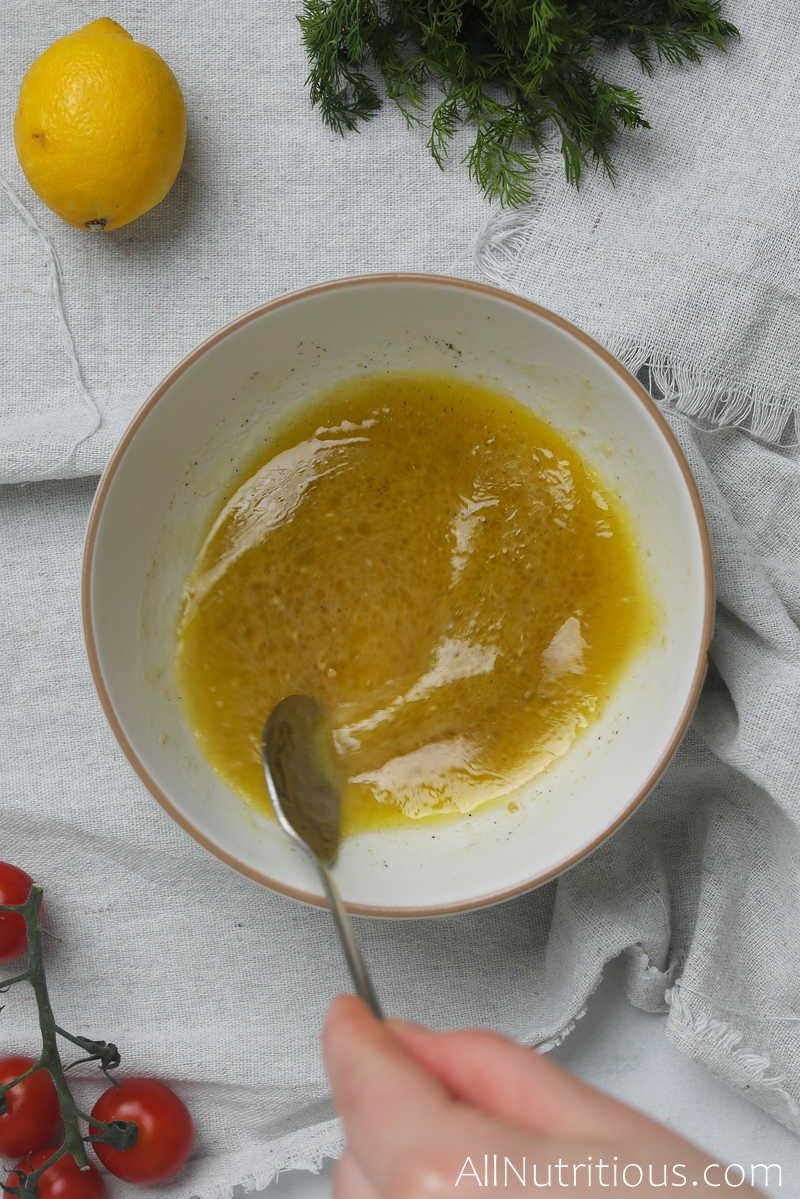 mixing dressing in bowl