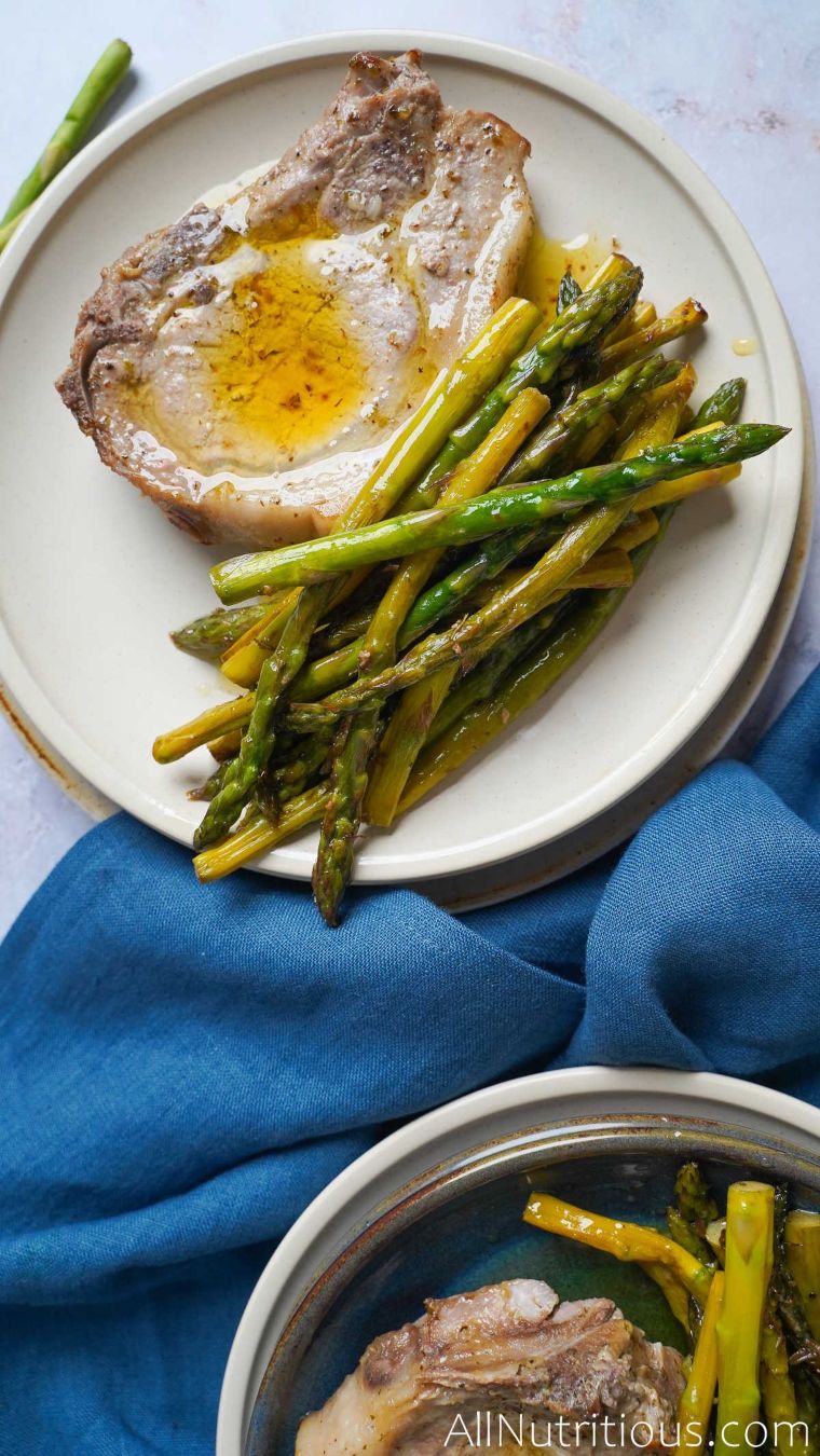 cooked pork chop and asparagus