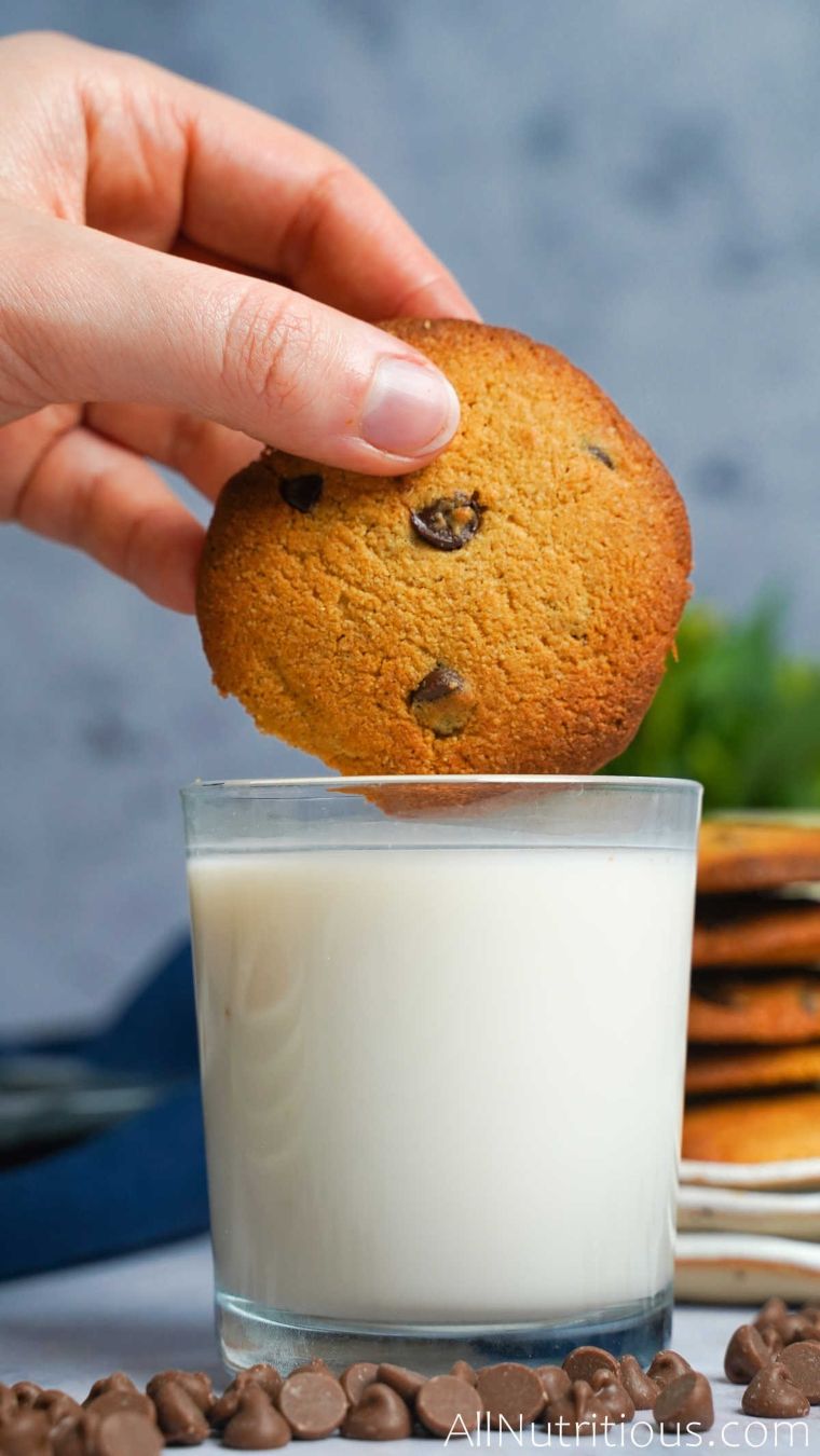 dipping cookie in milk