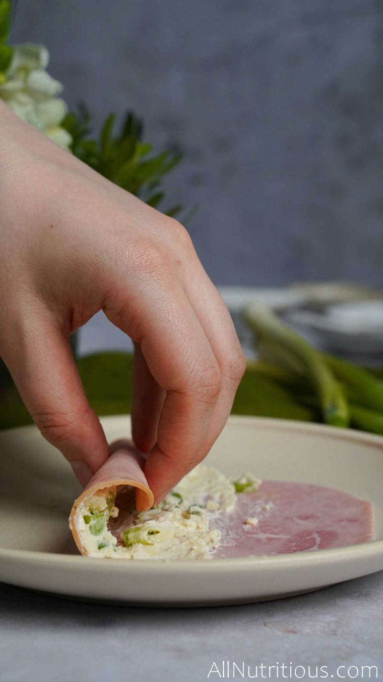 rolling up ham slice