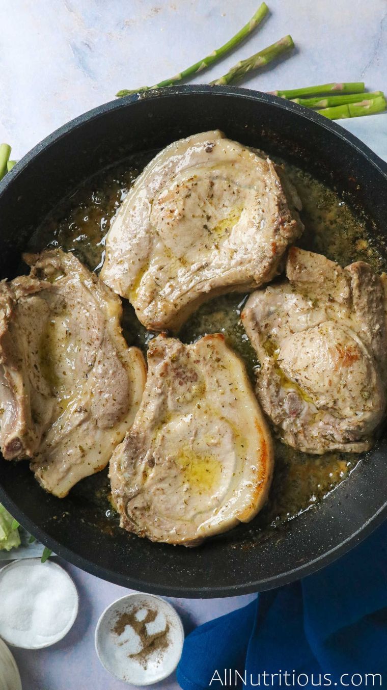 pork chops cooking with butter