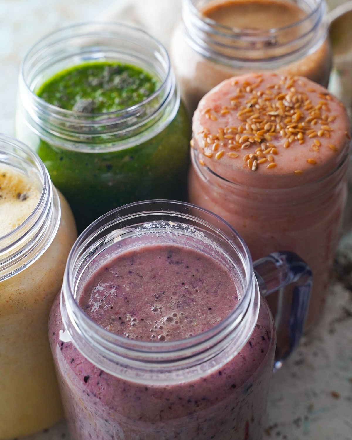 variety of smoothies in jars