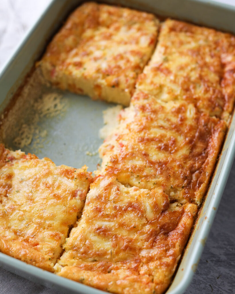 casserole dish with slice of quiche missing